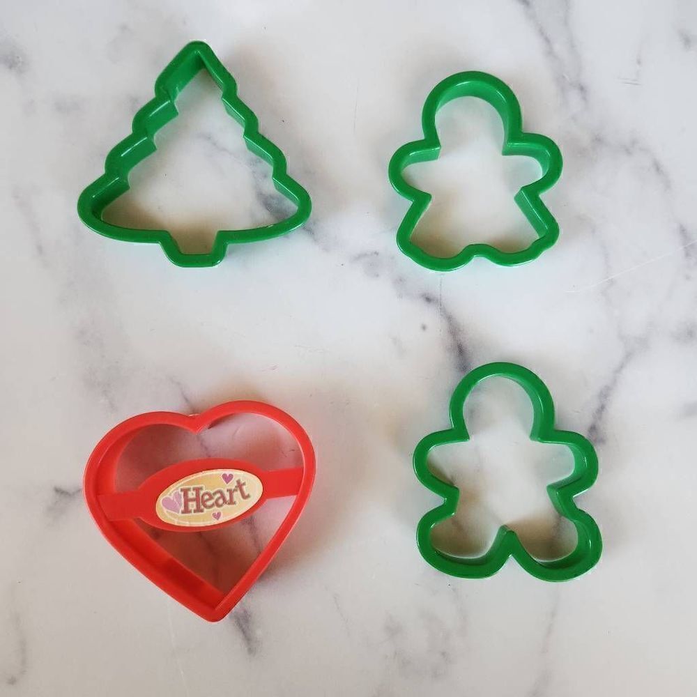 Set of four plastic cookie cutters gingerbread man pine tree heart 4x4